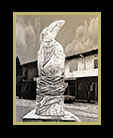 statue of a toucan in Belize - sepia thumbnail